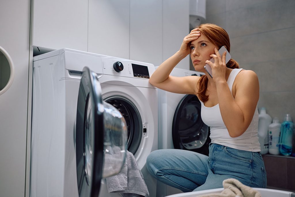 frustrated woman because her dryer isn't drying