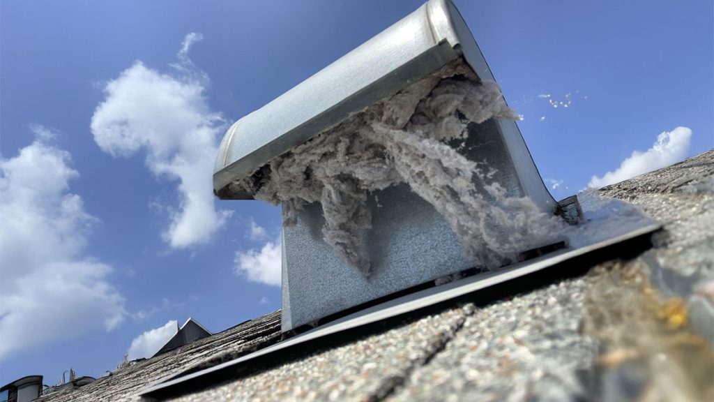 Excess lint coming out of a dryer vent roof cap