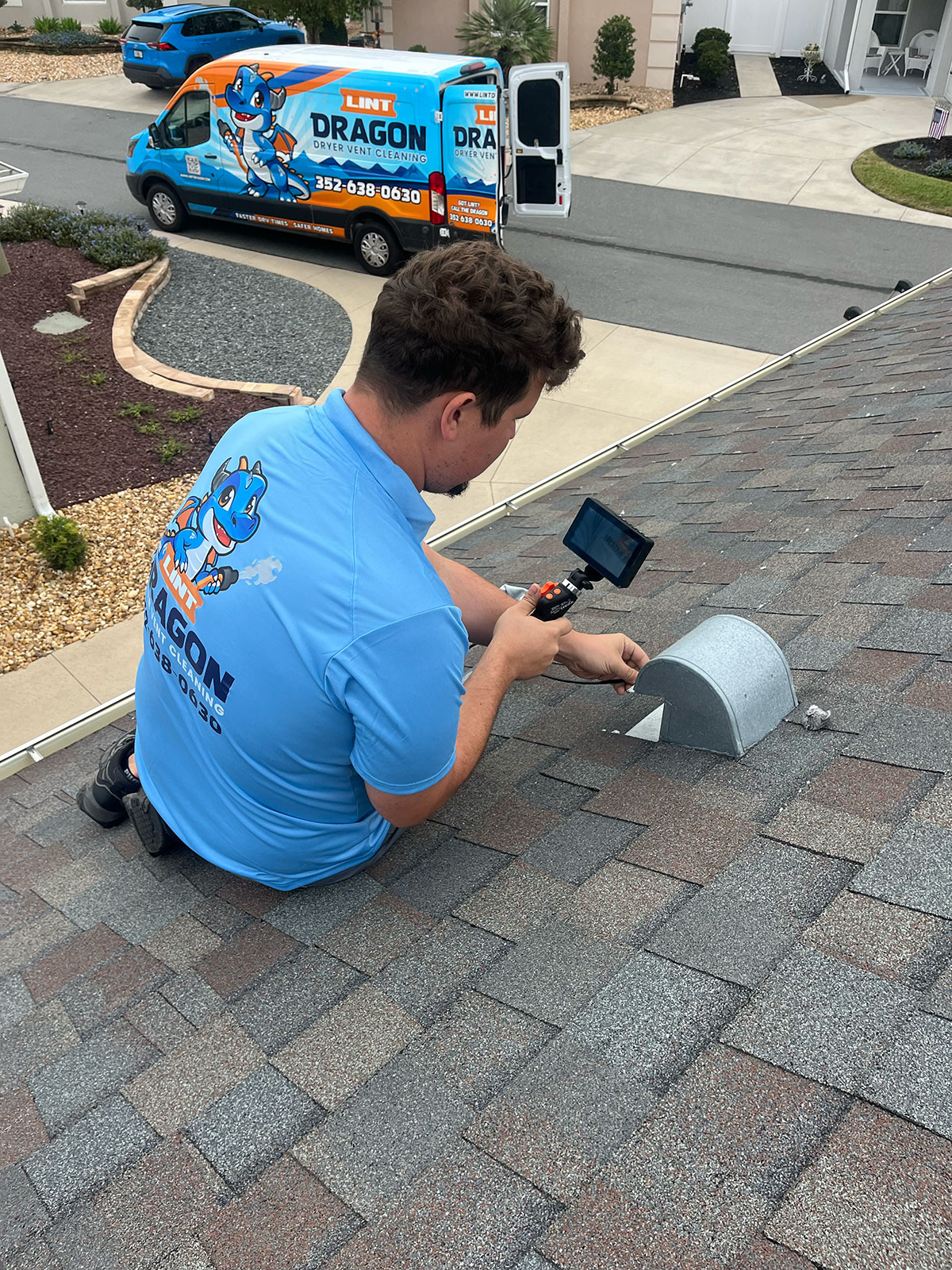 Dryer vent being inspected by a technician with a camera