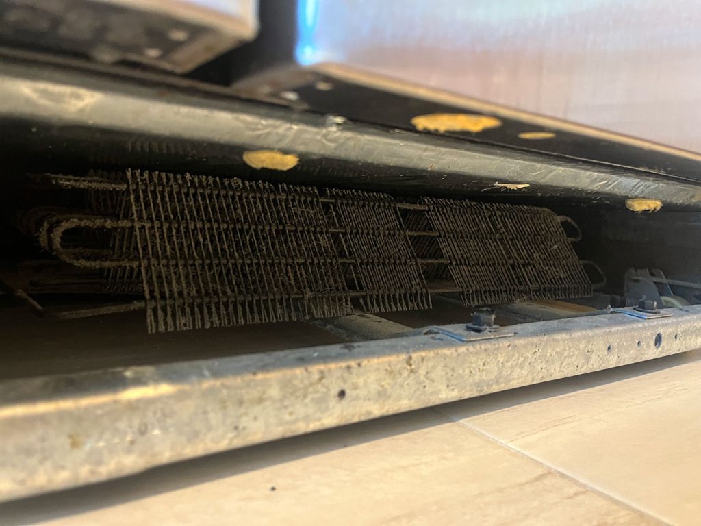 dirty refrigerator coils that need cleaning