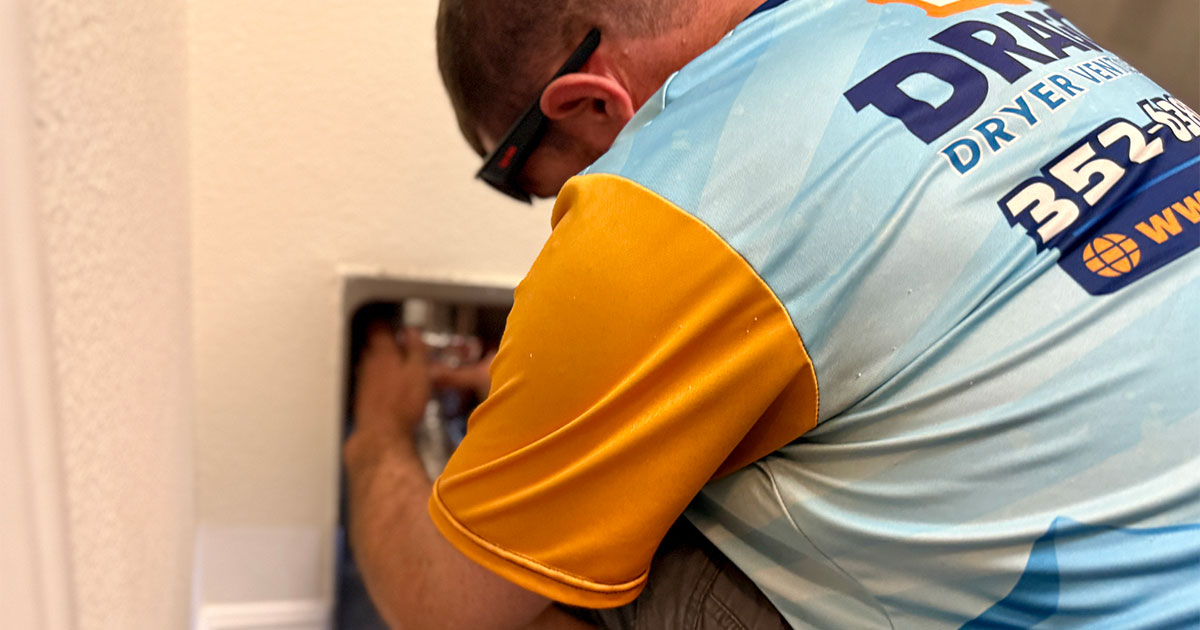 Lint Dragon Technician installing dryer hose