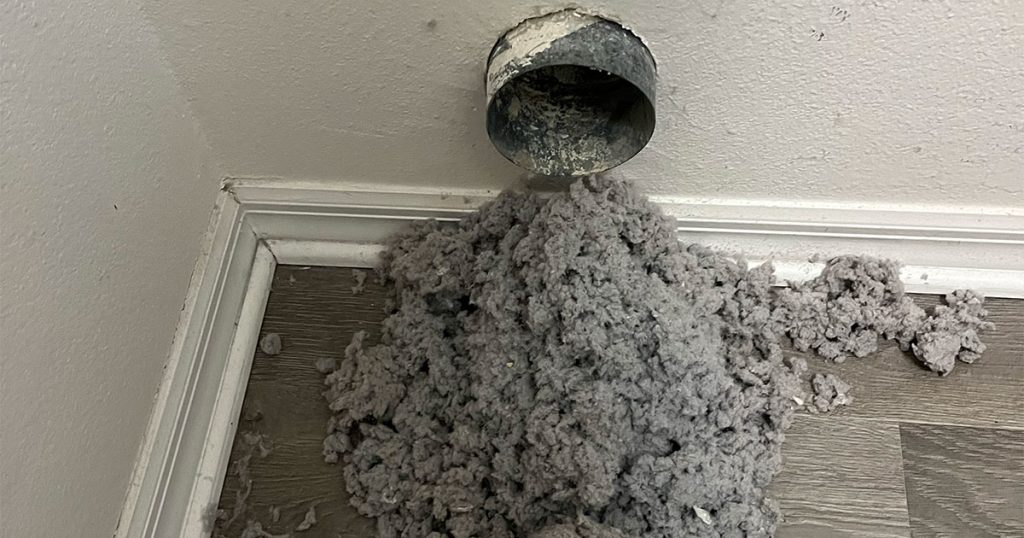 Dryer vent being cleaned of lint in ocala home